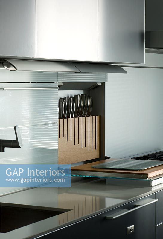 Contemporary kitchen with concealed pull down knife block
