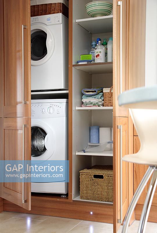 Concealed washing machine and tumble dryer in kitchen cupboards