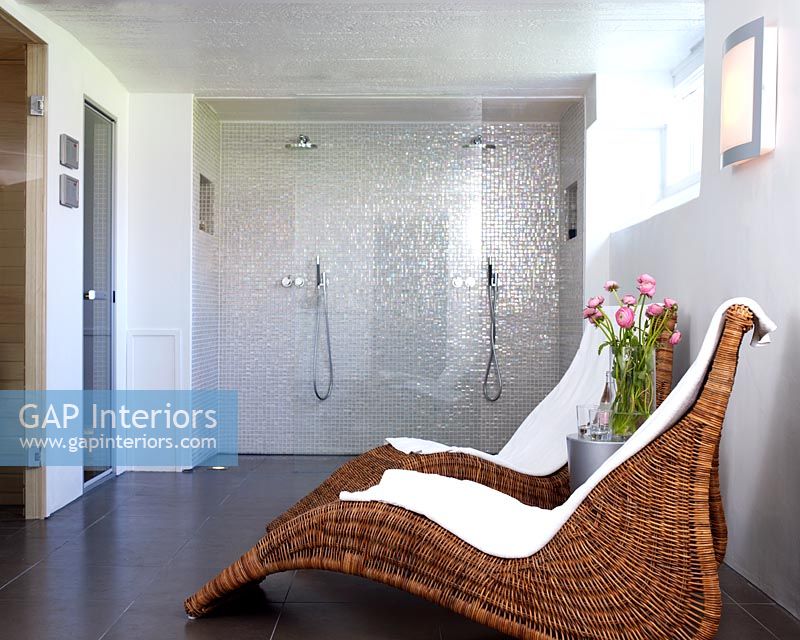 Contemporary bathroom with double shower and seating area