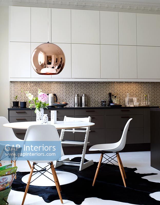 Modern kitchen with dining table and chairs