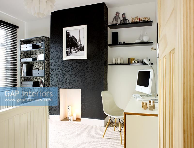 Contemporary home office and guest bedroom  with wallpapered chimney breast