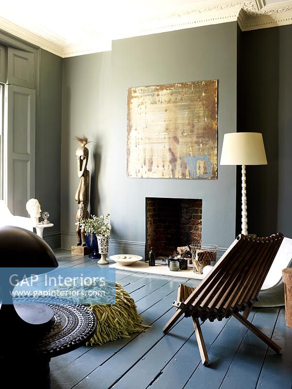 Grey living room with painted walls and floorboards 