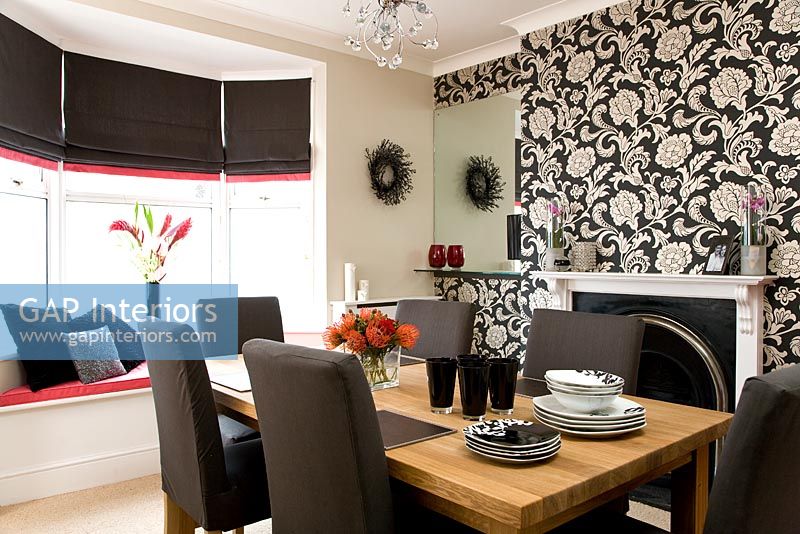 Modern dining room with wallpapered feature wall