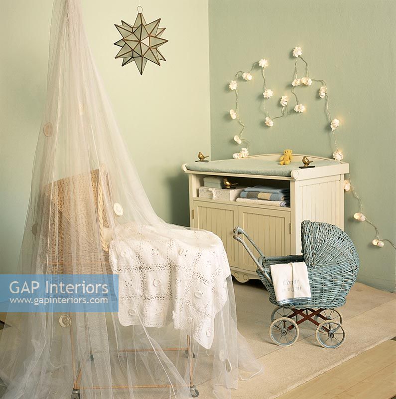 Canopy covered cot and toy pram