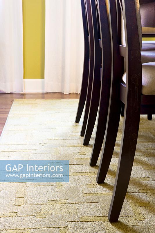 Chair Legs on Rug in Dining Room