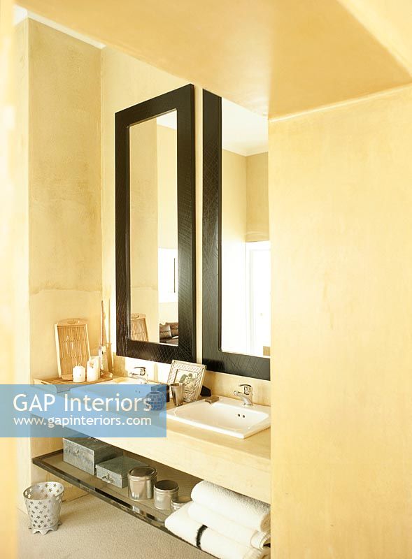 Interior of bathroom with bathroom sink and mirrors 