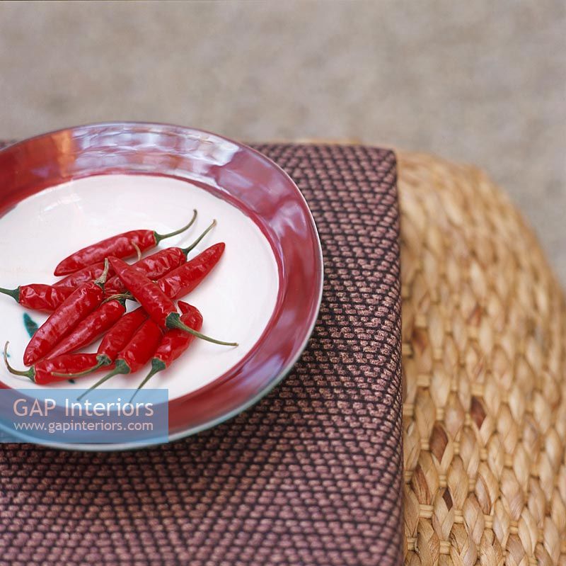 Red chillies on plates close-up
