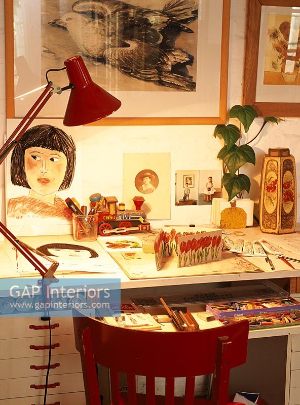 Artist's work desk with a collection of cards
