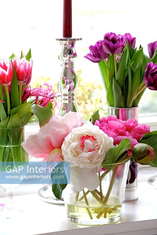 Various flower arrangements in vases