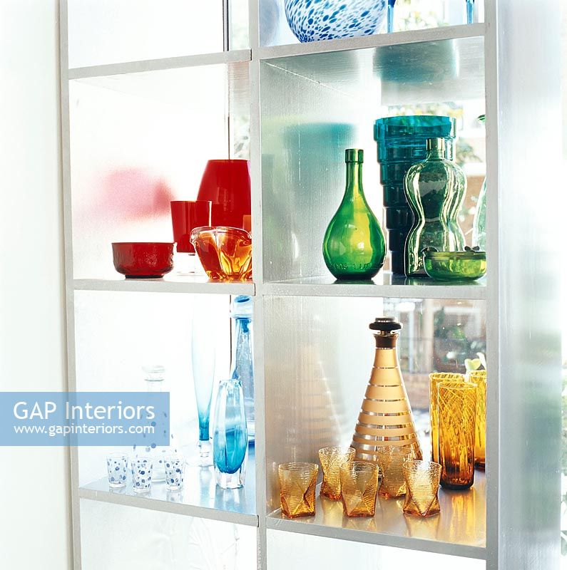 Colourful glassware on shelf