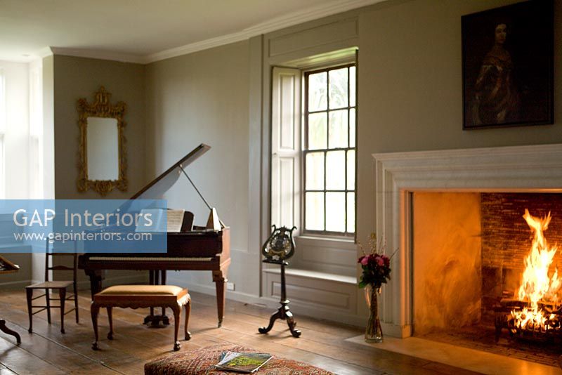Music room with roaring fire