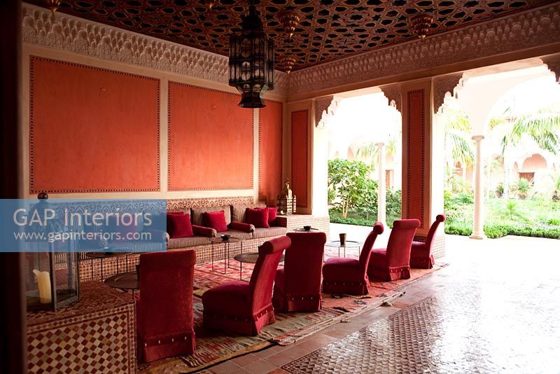 Red living room with moroccan style decor