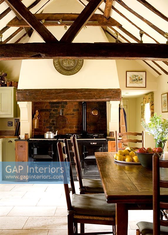 Wooden table and chairs in country kitchen 