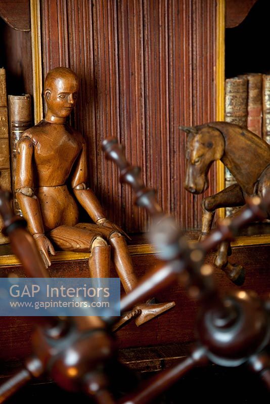 Wooden figures in living room detail