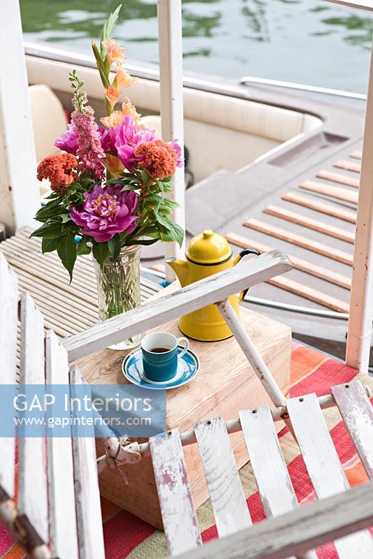 Garden chair on houseboat balcony 