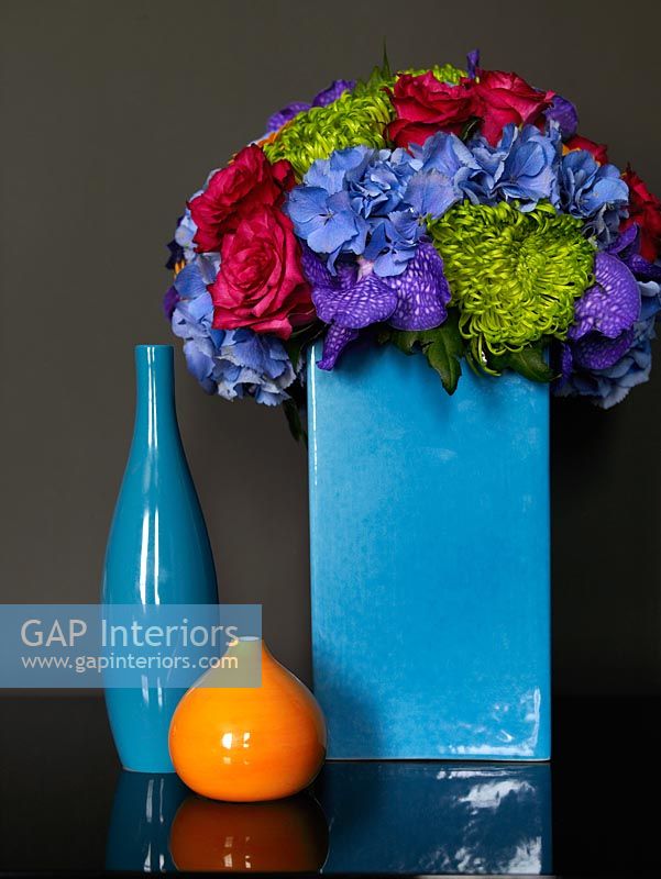 Blue vase and flower arrangement detail 