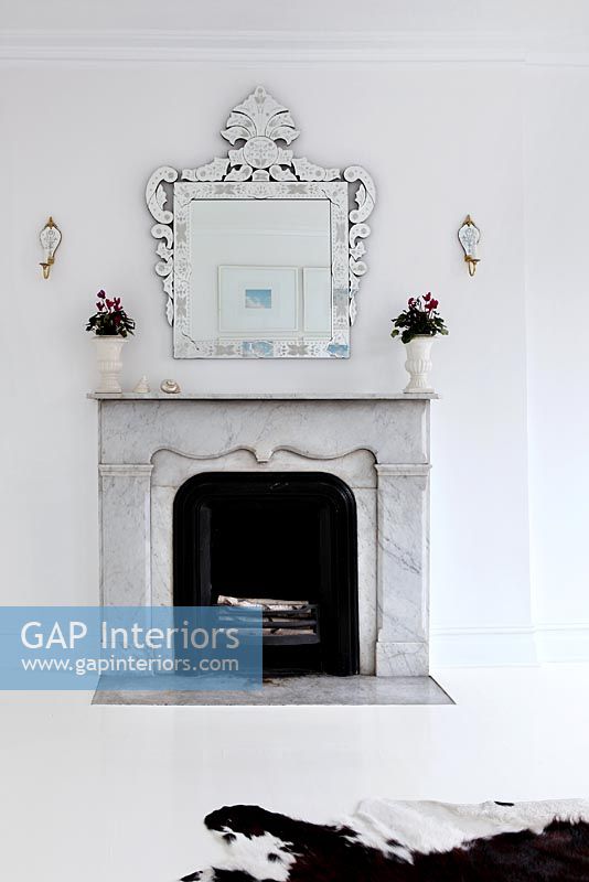 Marble fireplace in modern white living room