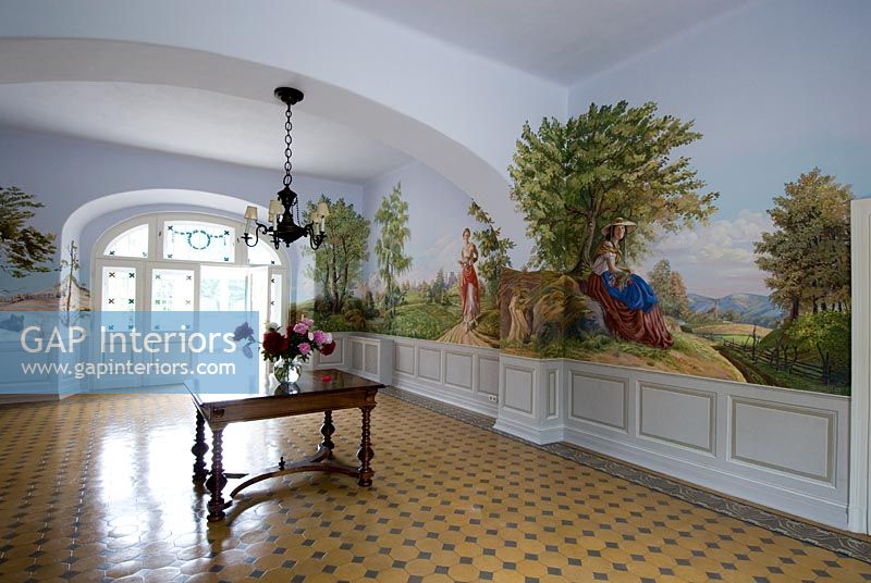 Grand entrance hall with large murals 