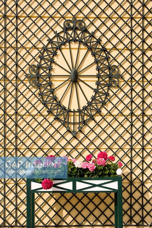 Decorative wall covering and flowers, detail