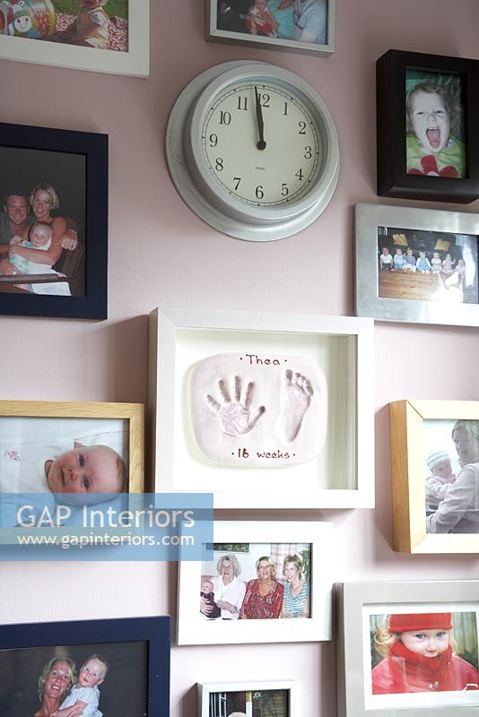 Wall of family photographs and collectibles 