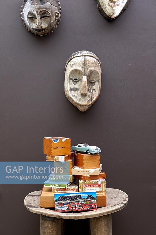 Carved wooden masks and display on table