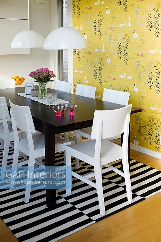 Dining table on black and white rug