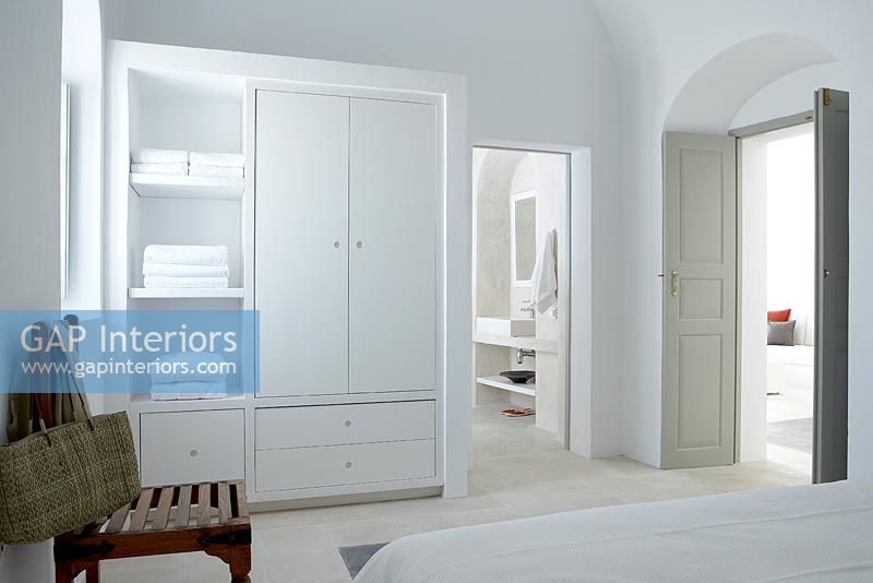 Modern wardrobe and shelves in bedroom