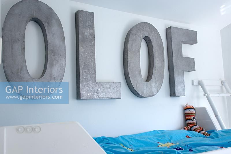 Modern childrens room with wall lettering