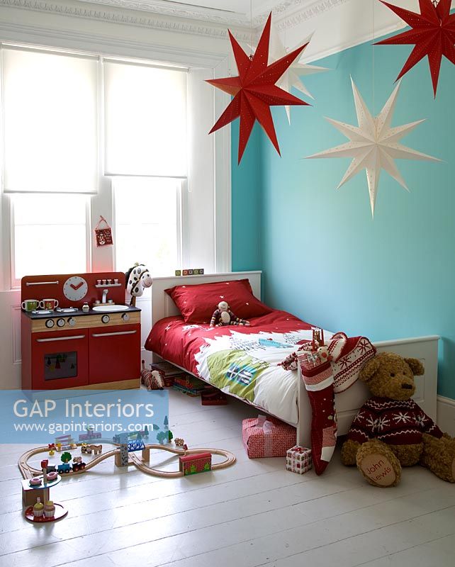 Childs room with star shaped lanterns