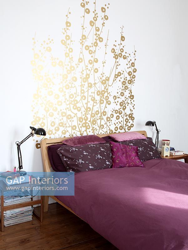 Floral mural above bed