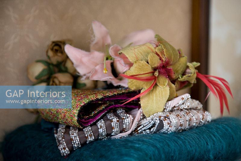 Collection of fabric flowers and scarves