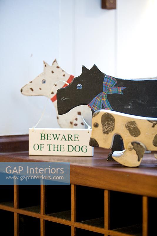 Wooden dog toys and 'Beware of the Dog' sign
