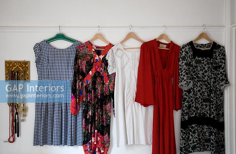 Collection of vintage dresses hanging up