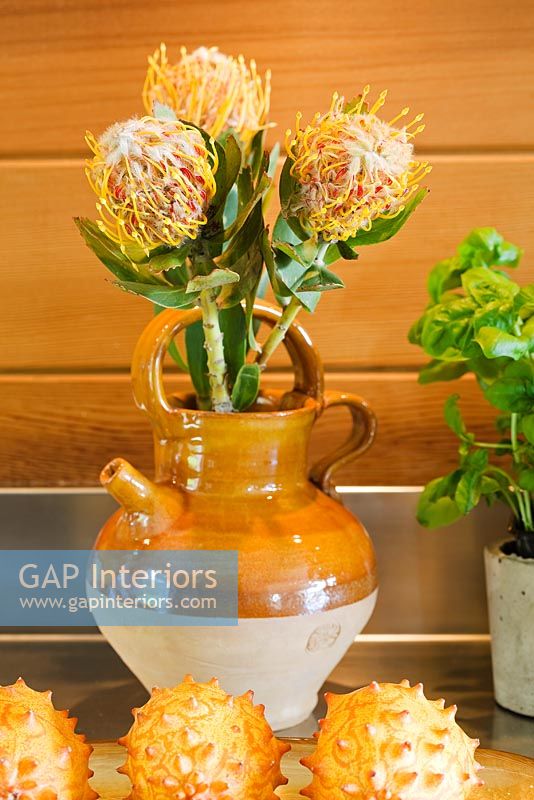 Flower arrangement in earthenware jug