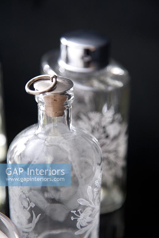 Detail of ornate glass perfume bottles 
