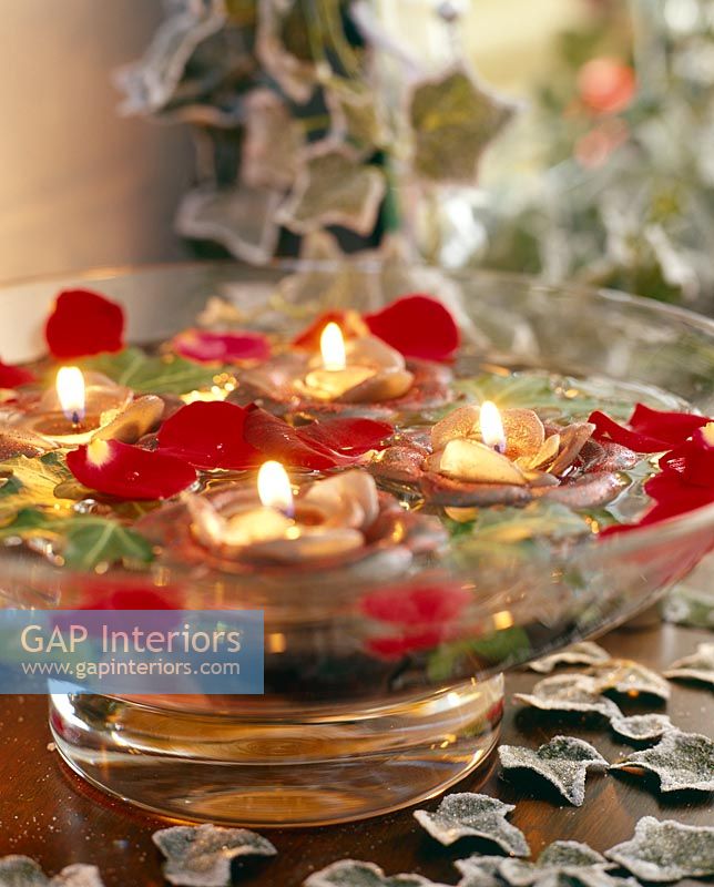 Floating floral candles in water bowl