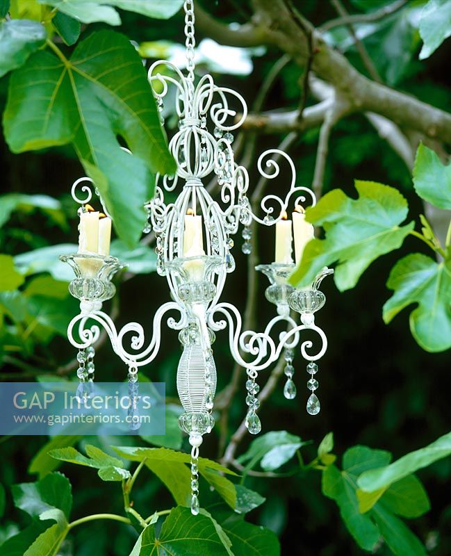 Candle chandelier in garden 