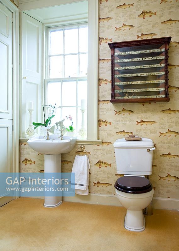 Modern bathroom with fish patterned wallpaper 