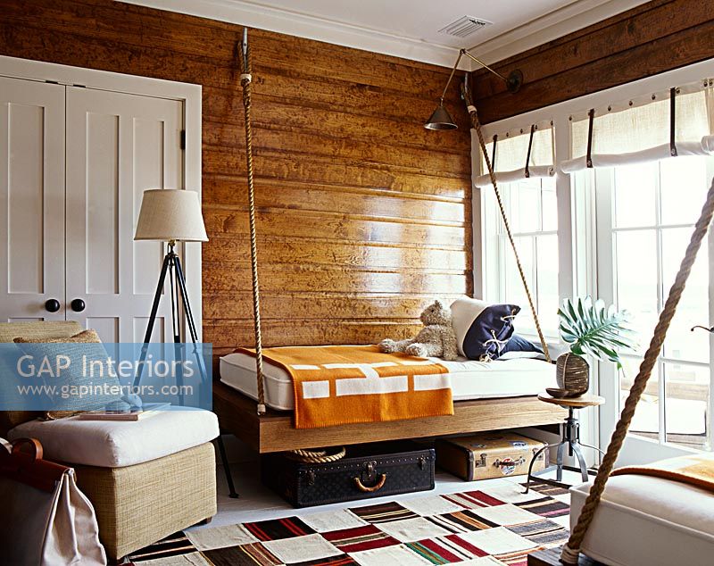 Classic bedroom with wooden paneled walls 