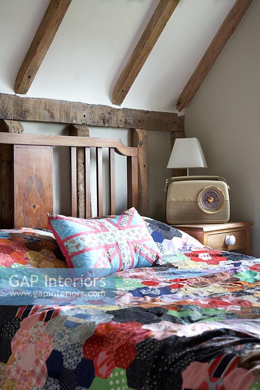 Country bedroom with patchwork quilt