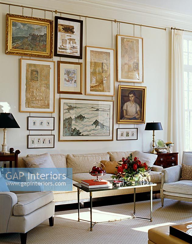 Classic living room with display of paintings 