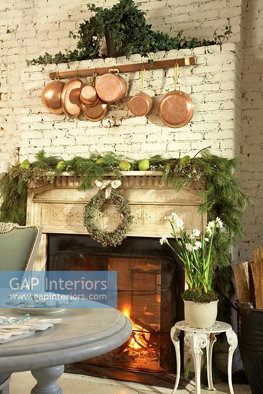 Christmas decorations over classic fireplace 