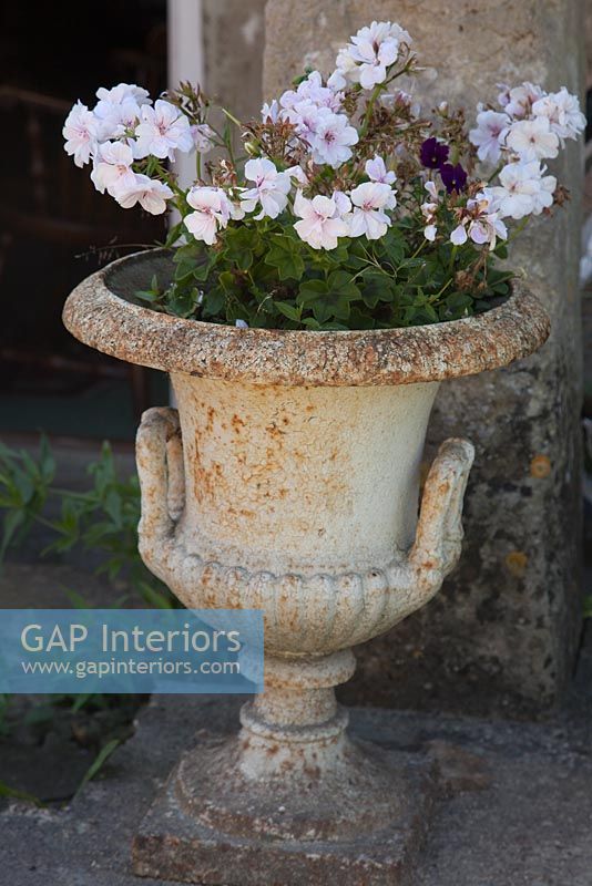 Country urn with flowering plants 