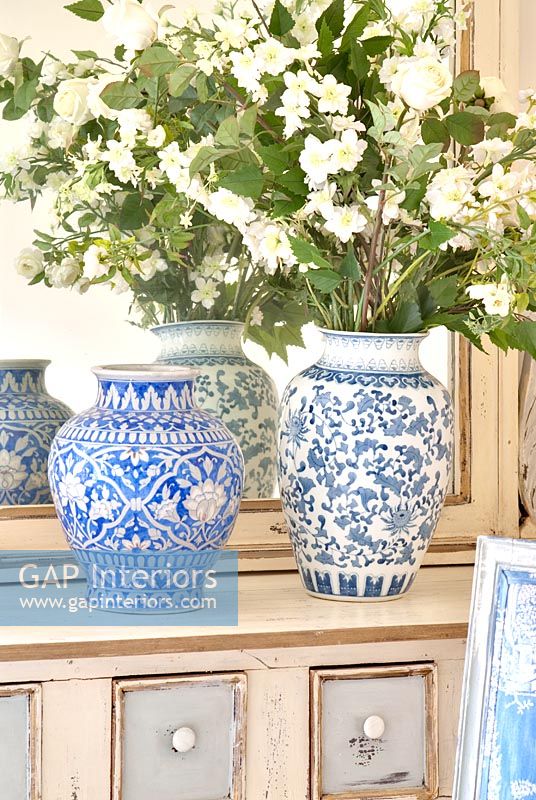 Pair of ceramic vases and flowers 