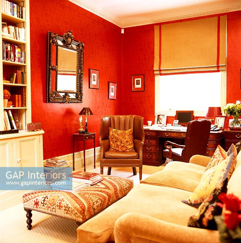 Classic living room with red painted walls 