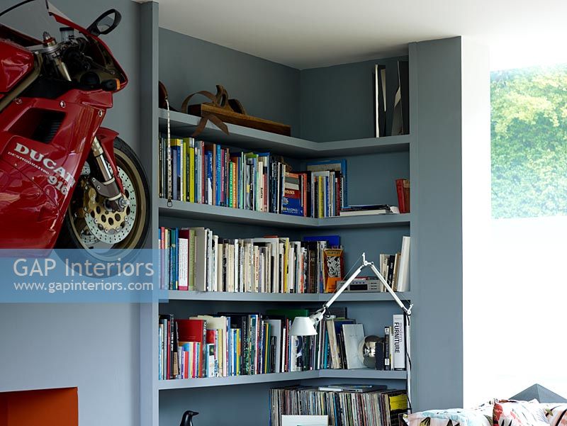 Motorbike on wall of eclectic living room