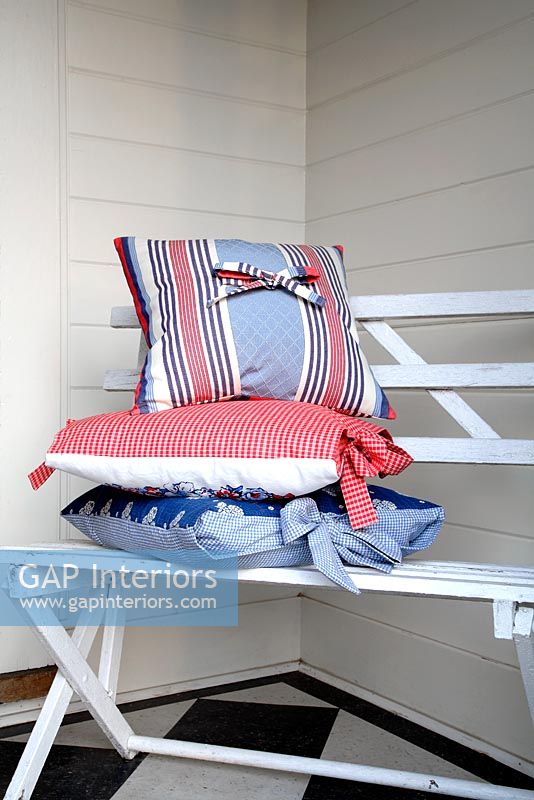 Cushions on wooden bench 