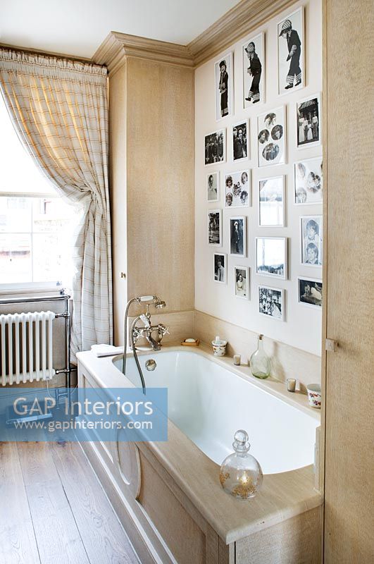 Classic bathroom with feature wall of photos 