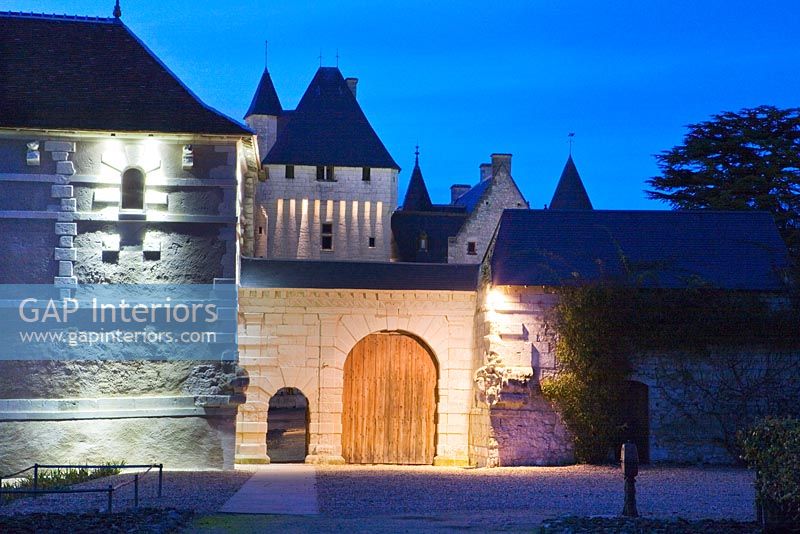 Entrance to castle lit up at night - Chateau du Riveau