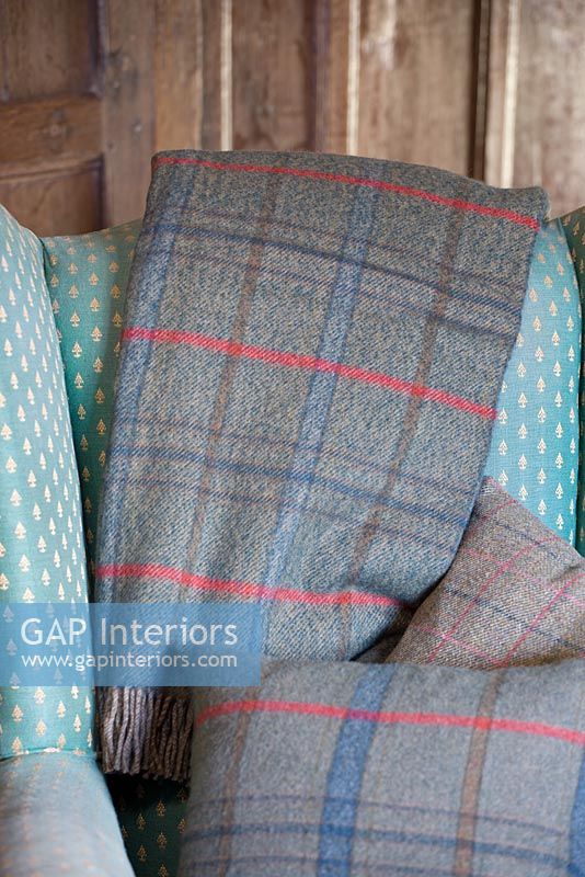Plaid wool throws and cushions